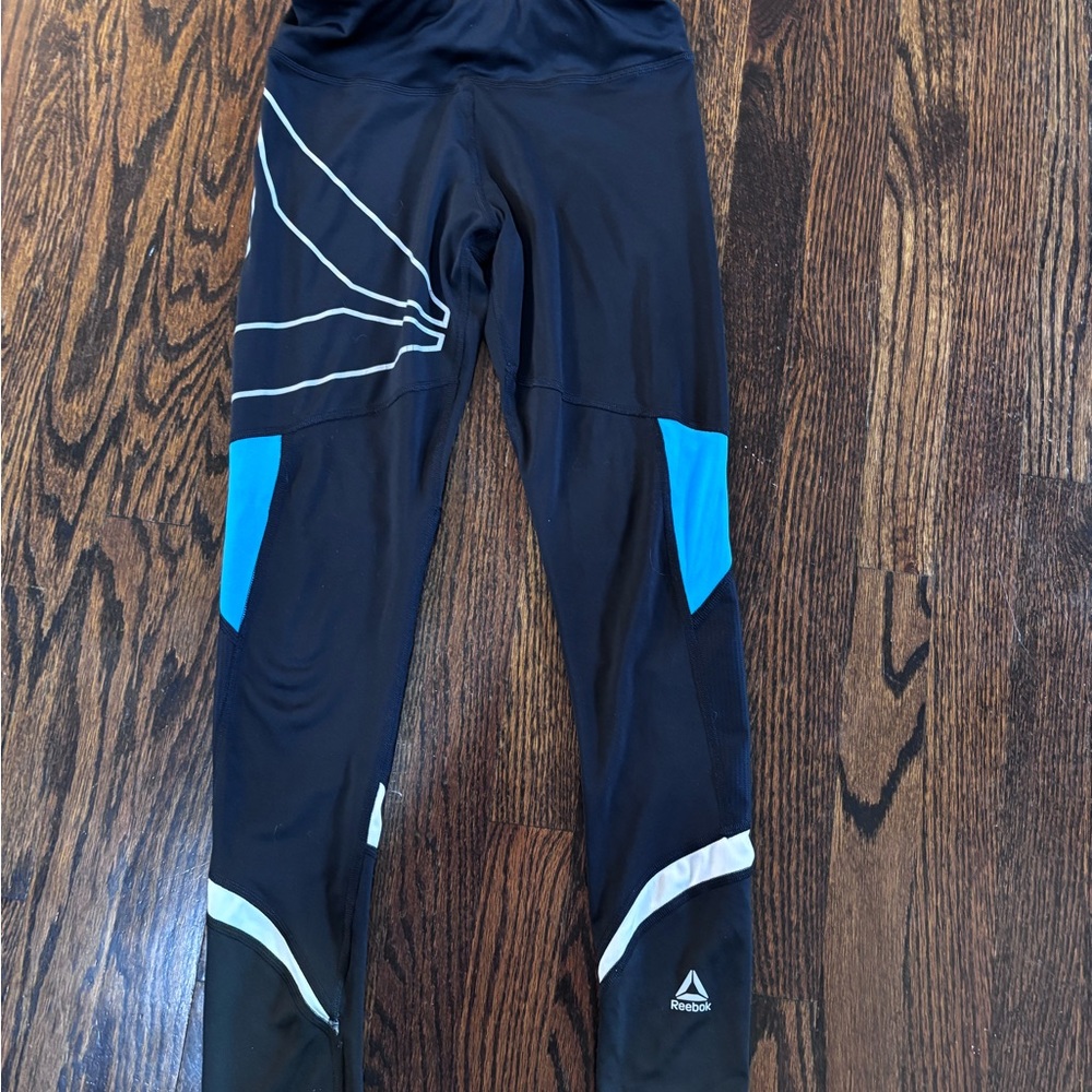 Reebok XS Black, Blue, and Silver Logo Leggings with Mesh Inserts